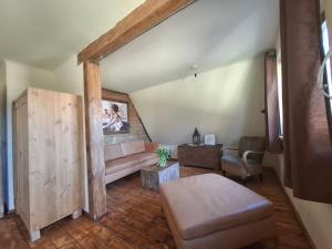 a living room with a couch and a table at Ferienhaus Witta in Radebeul