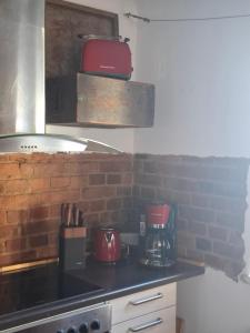 a kitchen with a counter top with a coffee maker at Ferienhaus Witta in Radebeul