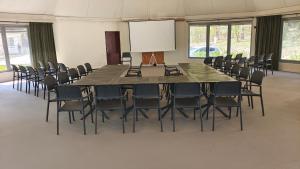 a large conference room with a large table and chairs at Krokodyl Sport&Spa in Mielno