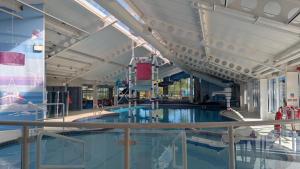 a large swimming pool in a building at Seton Sands caravan close to Edinburgh in Port Seton