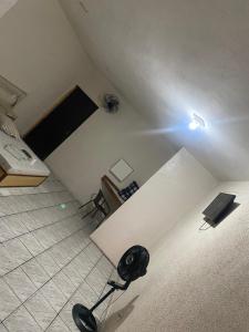 a room with a room with a bed and a desk at Hospedaria São Mateus in São Paulo