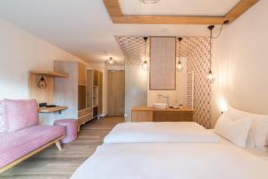 Voodi või voodid majutusasutuse Hotel Tofana toas