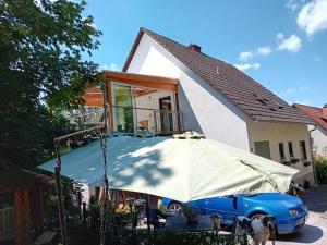 a blue car parked in front of a house at Ferienhaus Bundenthal in Bundenthal