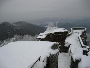 a person walking on a snow covered mountain at Ferienhaus Bundenthal in Bundenthal