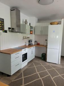 a kitchen with white appliances and a white refrigerator at Lauberhof in Trippstadt