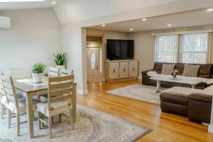 a living room with a table and a couch at The Great Escape in Clintondale