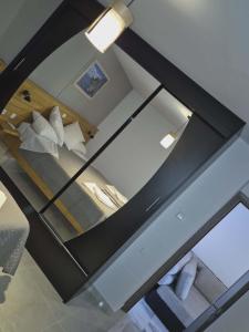 a glass window in a room with a bed at Ionian Balcony II in Athani
