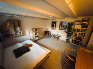 a bedroom with a bed and a desk and a table at Cozy and Spacious Guest Room, Virum in Virum