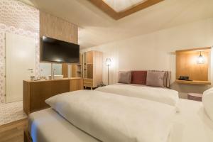Voodi või voodid majutusasutuse Hotel Tofana toas