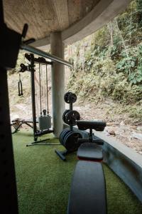 a view of a gym with a treadmill at Ahora Wellness Hostel in Guachaca