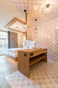 Voodi või voodid majutusasutuse Hotel Tofana toas