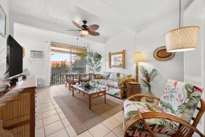a living room with a couch and a table at Kona Mansions#B217 Beautiful unit with Ocean view! in Kailua-Kona