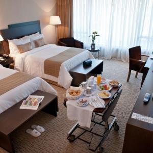 Postel nebo postele na pokoji v ubytování Gran Bourbon Hotel Asuncion
