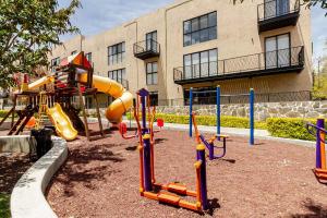 a playground with a slide in front of a building at Oasis privado en Querétaro in Alvarado