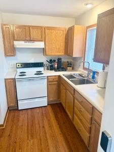a kitchen with a white stove and a sink at Wildcat 4020 in Marion