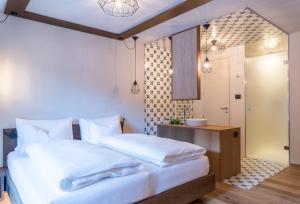 Voodi või voodid majutusasutuse Hotel Tofana toas