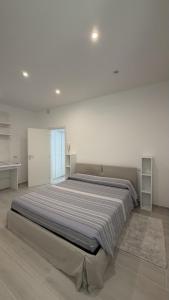a large bedroom with a large bed in a room at Casa Flavia in Lierna +32 photos