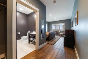 a bathroom with a sink and a toilet in a room at Timber Baron Inn in Bayfield