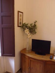 Telewizja i/lub zestaw kina domowego w obiekcie Apartamento