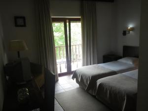 Postel nebo postele na pokoji v ubytování Hotel Rural Quinta de Novais
