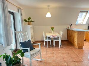 a kitchen and dining room with a table and chairs at Finnhaus Fiete in Marlow +11 photos