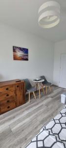 a living room with two chairs and a table at Willa North Star in Władysławowo +48 photos