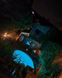 an overhead view of a house with a swimming pool at night at Ferienhaus-Sauna Pool Whirlpool in Grimma