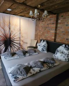 a group of pillows on a couch in a room at Ferienhaus-Sauna Pool Whirlpool in Grimma +5 photos