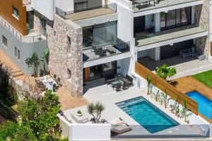 an aerial view of a building with a swimming pool at Ortus Luxury Residence in Rhodes Town