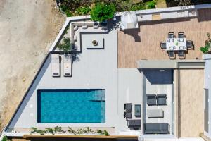 an aerial view of a house with a swimming pool at Ortus Luxury Residence in Rhodes Town