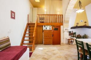 a room with a staircase leading to a bedroom at Eligia home in Angouselianá