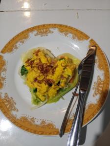 a plate of food in the shape of a heart at Naicha Green in Tetebatu +16 photos