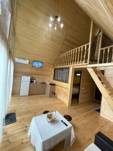 a room with a table and a bunk bed at Makhuntseti Inn in Makhunts'et'i +22 photos