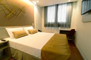 Postel nebo postele na pokoji v ubytování Easy Hotel Cachoeiro de Itapemirim by Atlantica