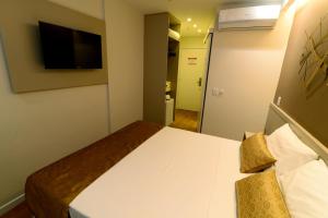 Postel nebo postele na pokoji v ubytování Easy Hotel Cachoeiro de Itapemirim by Atlantica