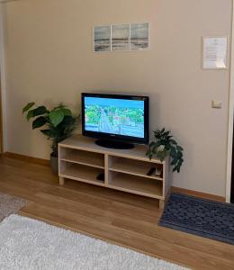 a television sitting on a stand in a living room at Andsuuria Apartment in Paide