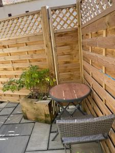 a patio with a table and a fence at Willow Lodge in Kilham
