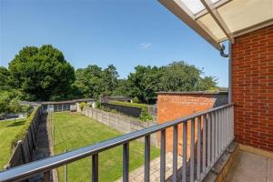 a balcony with a view of a yard at CoSY HOME in Mortsel