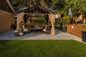 a gazebo with chairs and a table in a yard at Serene Mountain Retreat With Pool in Clermont