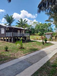 a house with a pathway in front of it at Le coin des Maripas in Quesnel +8 photos