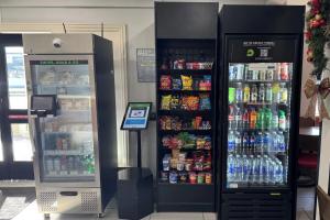 two soda machines in a store with drinks at Hotel 1550 - SFO Airport FREE Shuttle in San Bruno