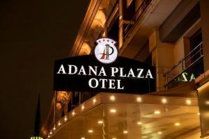 a sign on the side of a building at Adana Plaza Hotel in Adana