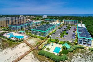 an aerial view of a resort with a pool and parking lot at Plantation East #3117 in Gulf Highlands