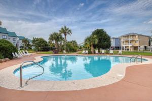 a large swimming pool in a apartment complex at #1131 The Mermaid Pad in Gulf Highlands