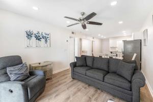 a living room with a couch and a ceiling fan at Plantation East #3312 in Gulf Highlands