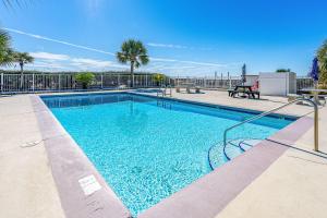 a large swimming pool with blue water at Plantation East #1201 in Gulf Highlands