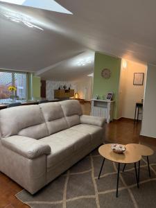 a living room with a couch and a table at SvEly House B&B in Campomarino +13 photos