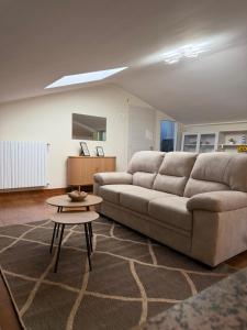 a living room with a couch and a table at SvEly House B&B in Campomarino