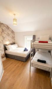 a bedroom with two bunk beds in a room at Mayfair hotel Blackpool city centre in Blackpool
