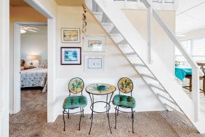 a dining room with a table and two chairs at Fine Fish House in Gulf Highlands